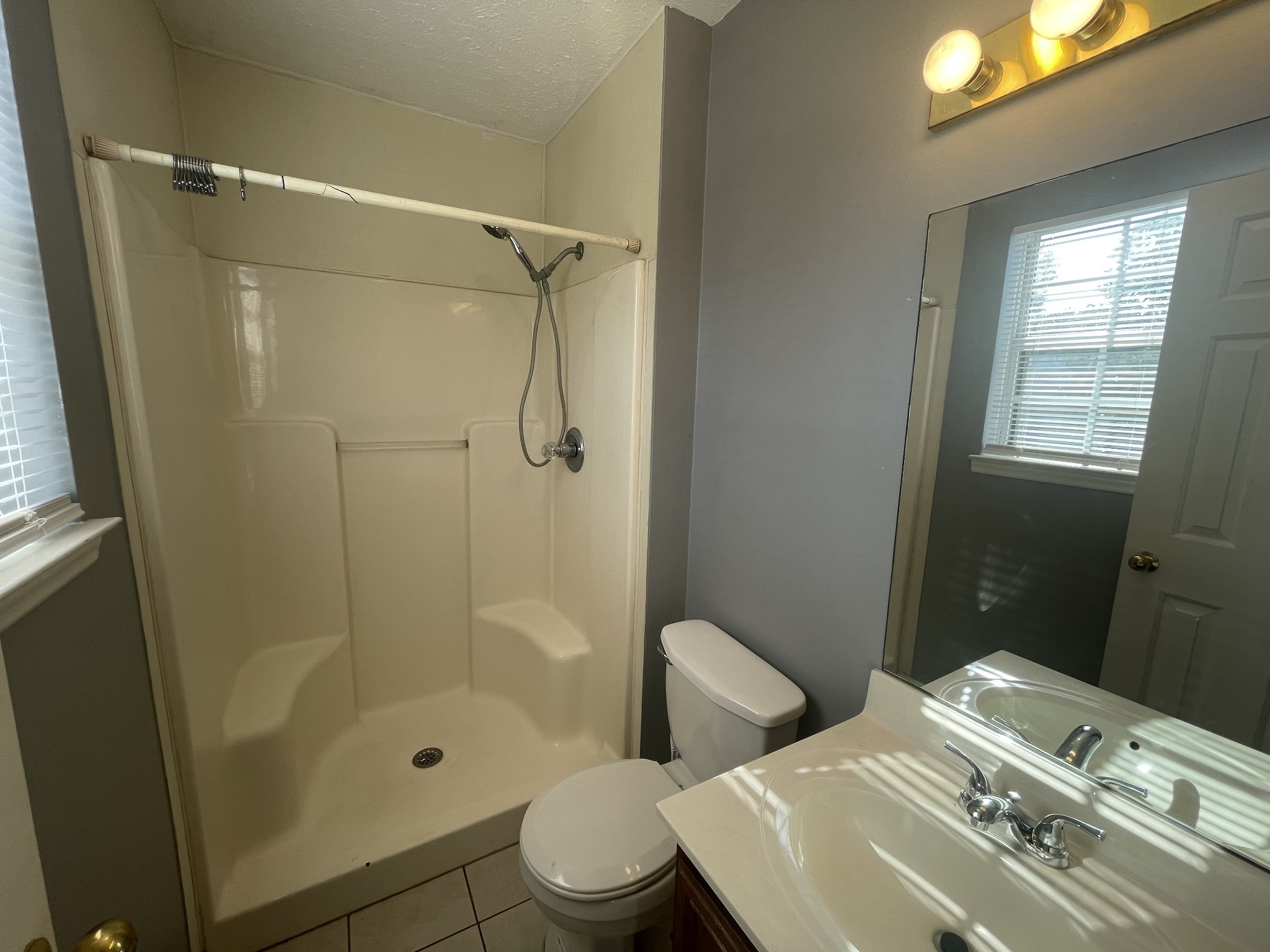 2505 Tinnell Court, Unit 2505 Murfreesboro, TN 37129 - Photo 9 of 11 a bathroom with a sink toilet and shower