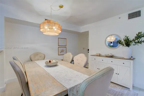 a bedroom with a bed and chandelier