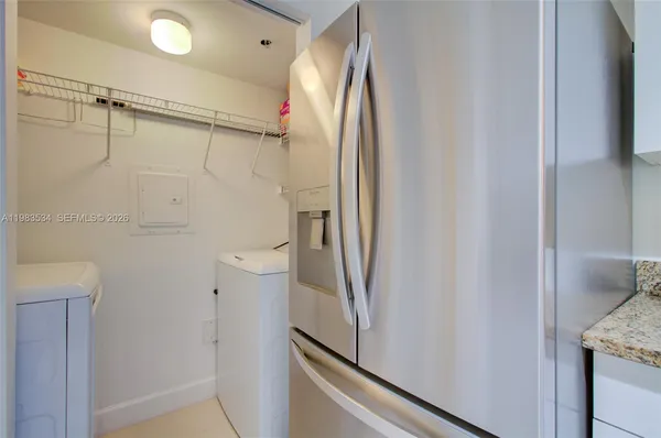 a bathroom with a shower and a sink