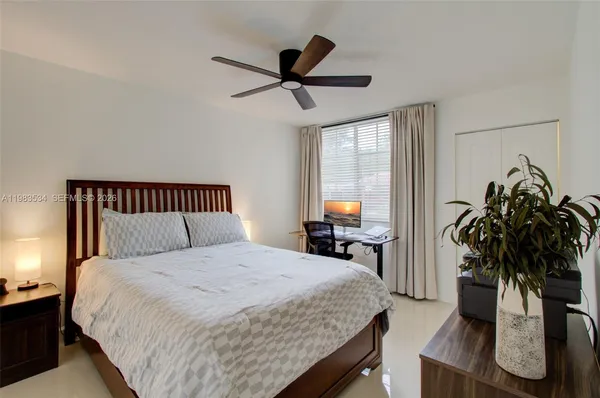 a bedroom with a bed and furniture