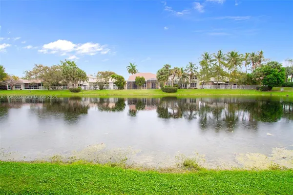 a view of a lake with a building in the background
