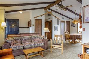 a bedroom with furniture and a chandelier