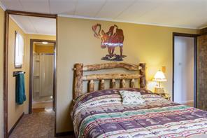 361 Lagoon Lane Silverthorne, CO 80498 - Photo 12 of 24 a bedroom with a bed and a painting on the wall