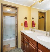 361 Lagoon Lane Silverthorne, CO 80498 - Photo 13 of 24 a bathroom with a double vanity sink and a mirror