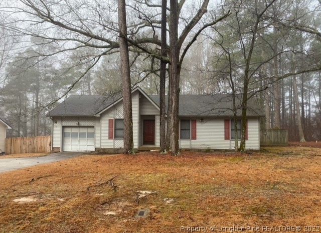 1750 Rim Road Fayetteville, NC 28314 - Photo 1 of 22 a front view of a house with a yard