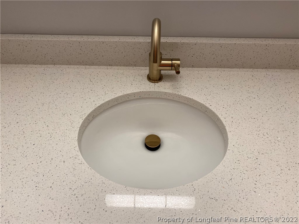 1750 Rim Road Fayetteville, NC 28314 - Photo 18 of 22 a bathroom with a sink