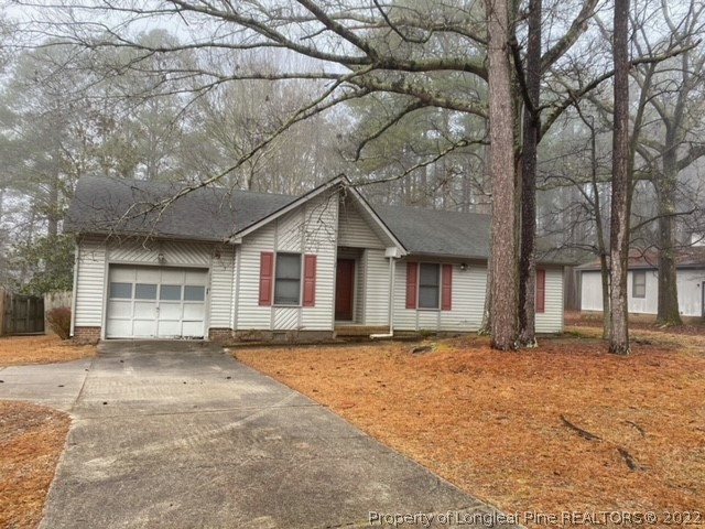 1750 Rim Road Fayetteville, NC 28314 - Photo 2 of 22 a view of a house with a yard covered in snow
