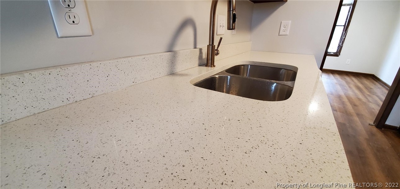 1750 Rim Road Fayetteville, NC 28314 - Photo 6 of 22 a kitchen with a sink and refrigerator