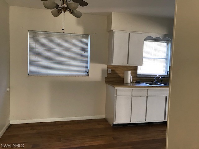 18624 Flamingo Road Fort Myers, FL 33967 - Photo 2 of 6 a kitchen with a sink cabinets and wooden floor