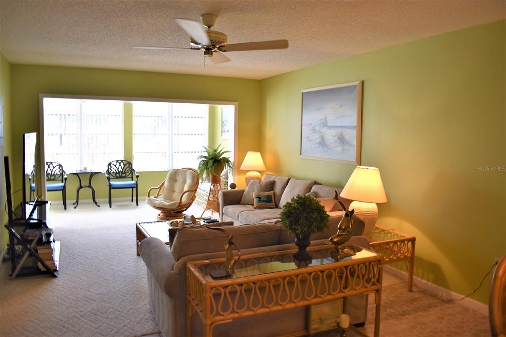 448 Cerromar Road, Unit 189 Venice, FL 34293 - Photo 12 of 48 a living room with furniture and a large window