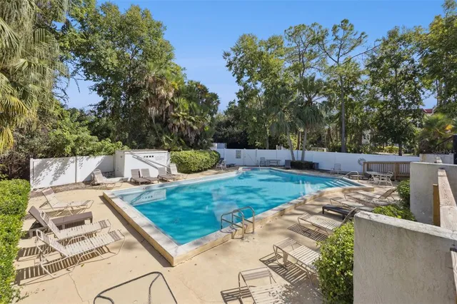a view of a backyard with sitting area