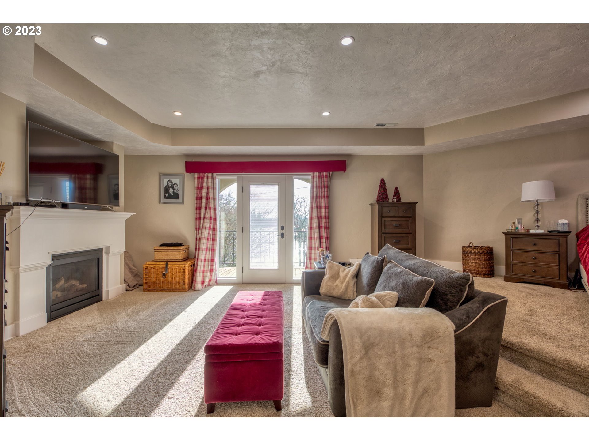 315 Ayres Road Eugene, OR 97408 - Photo 14 of 31 a living room with furniture a fireplace and a flat screen tv