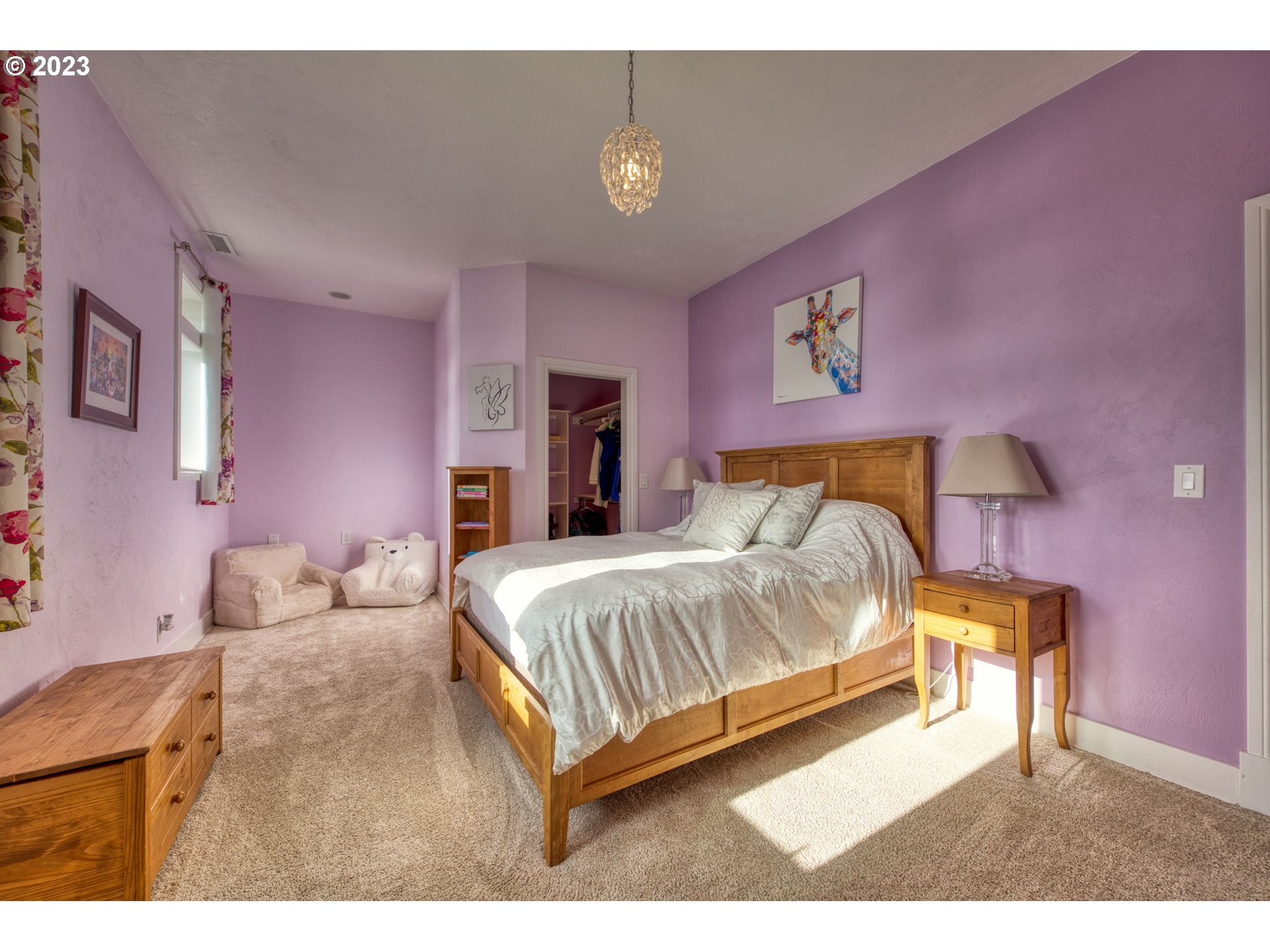 315 Ayres Road Eugene, OR 97408 - Photo 19 of 31 a bedroom with a bed and a chandelier