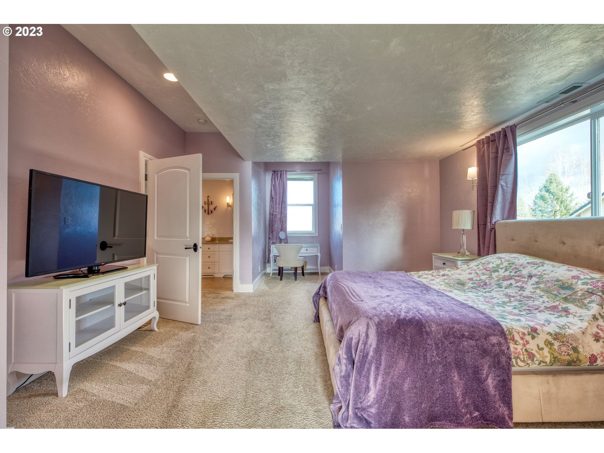 315 Ayres Road Eugene, OR 97408 - Photo 20 of 31 a spacious bedroom with a bed and a flat screen tv