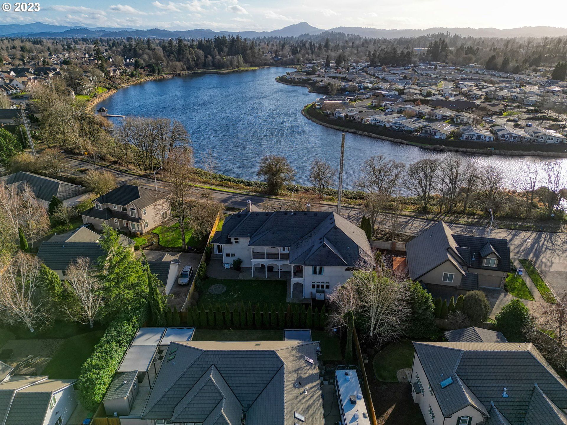 315 Ayres Road Eugene, OR 97408 - Photo 28 of 31 an aerial view of a house with a yard lake and outdoor seating