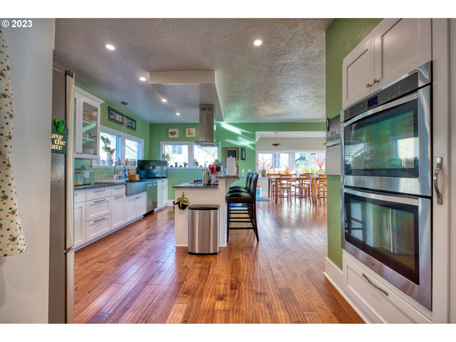 315 Ayres Road Eugene, OR 97408 - Photo 5 of 31 a open kitchen with white cabinets and stainless steel appliances