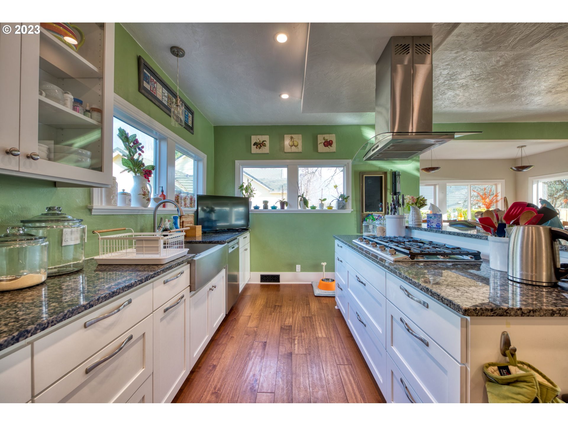 315 Ayres Road Eugene, OR 97408 - Photo 6 of 31 a large kitchen with stainless steel appliances granite countertop a lot of counter space and a large window