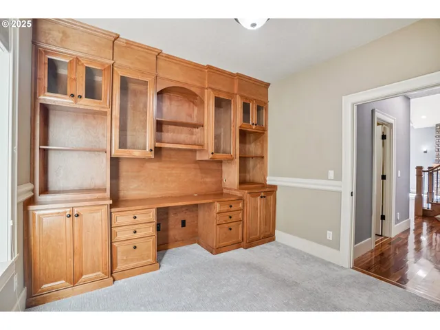 a kitchen with cabinets and window