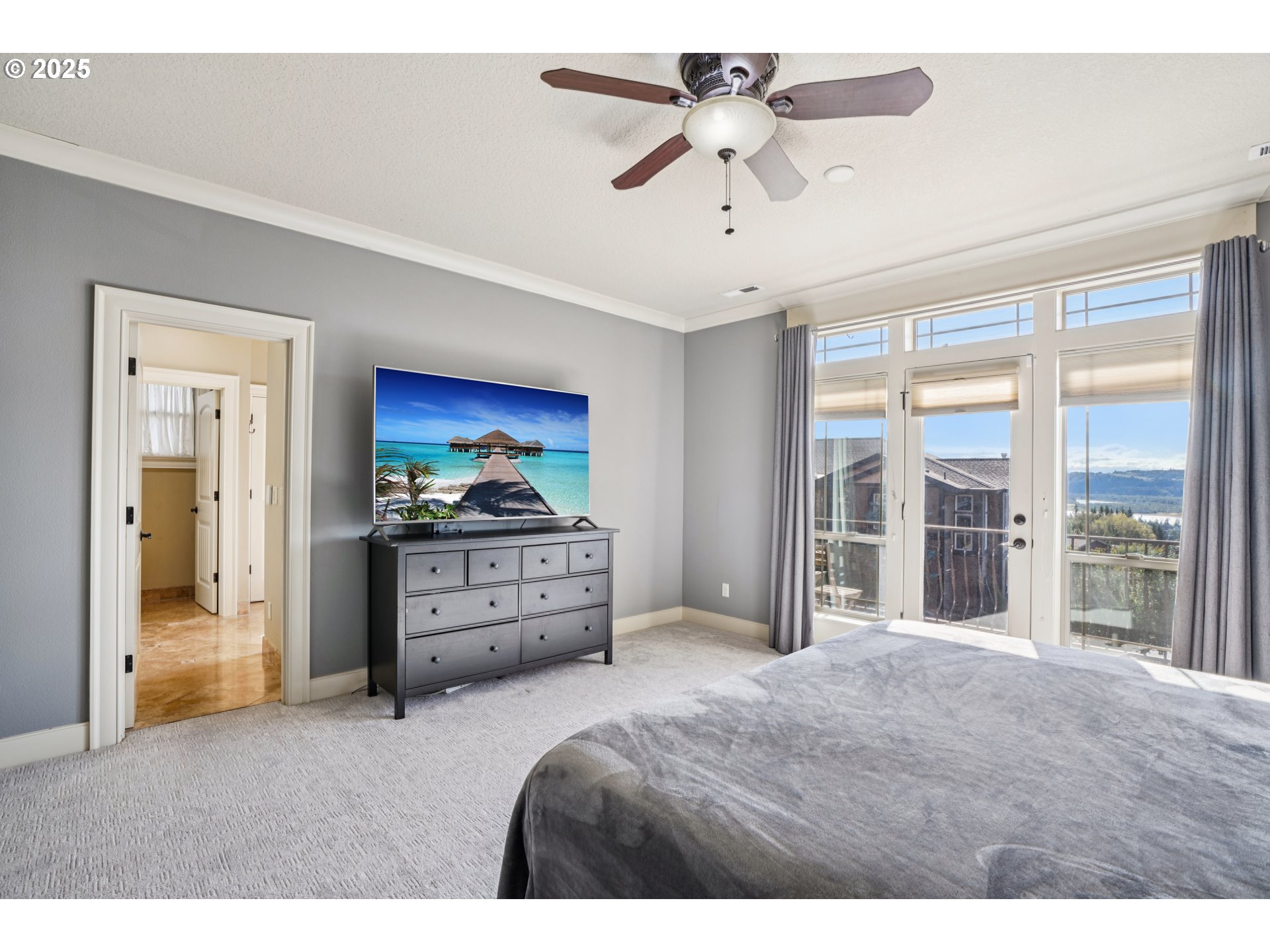 795 West X Street Washougal, WA 98671 - Photo 19 of 41 a bedroom with a bed and a large window with a fan