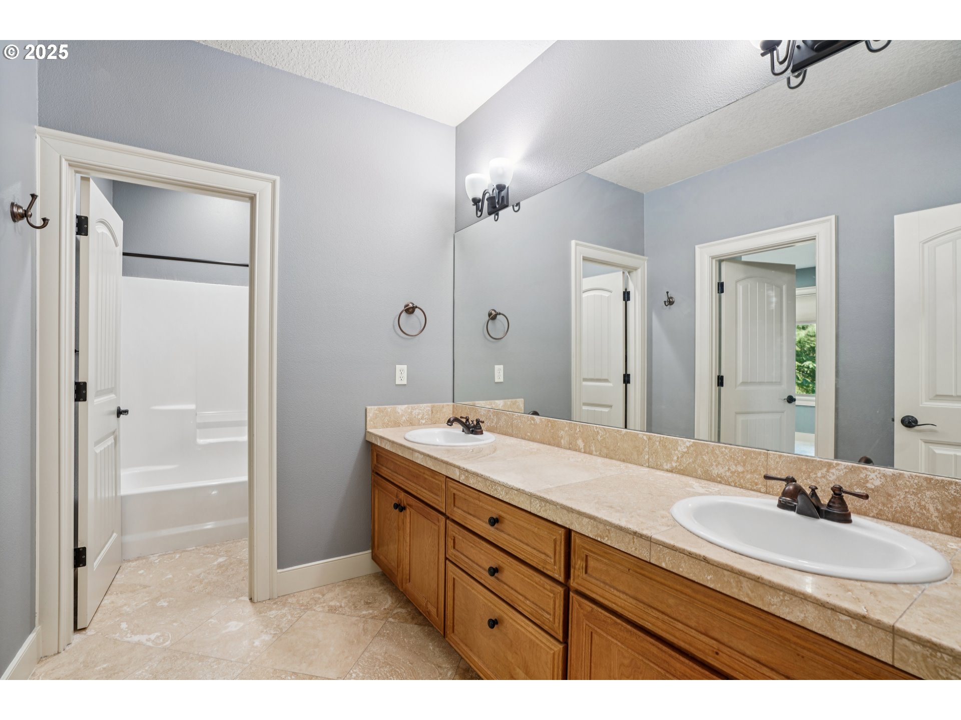 795 West X Street Washougal, WA 98671 - Photo 22 of 41 a bathroom with a sink and a mirror
