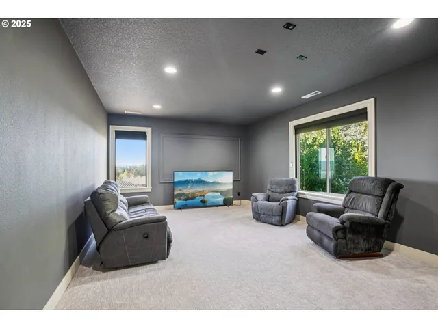 a living room with furniture and windows