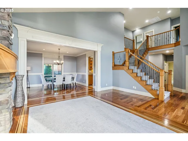 a view of a livingroom with furniture a table and chairs