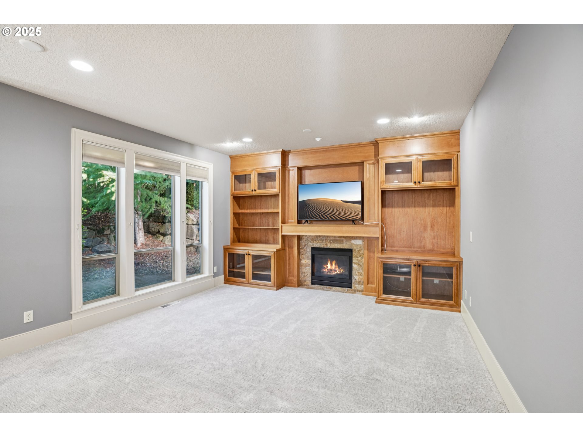 795 West X Street Washougal, WA 98671 - Photo 7 of 41 a living room with furniture a flat screen tv and floor to ceiling window