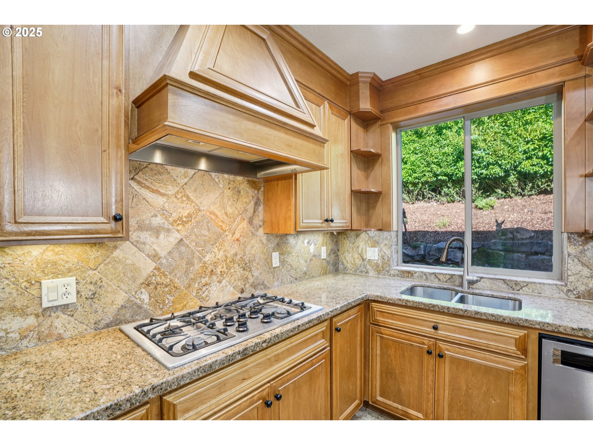 795 West X Street Washougal, WA 98671 - Photo 9 of 41 a kitchen with stainless steel appliances a stove a sink and a cabinets
