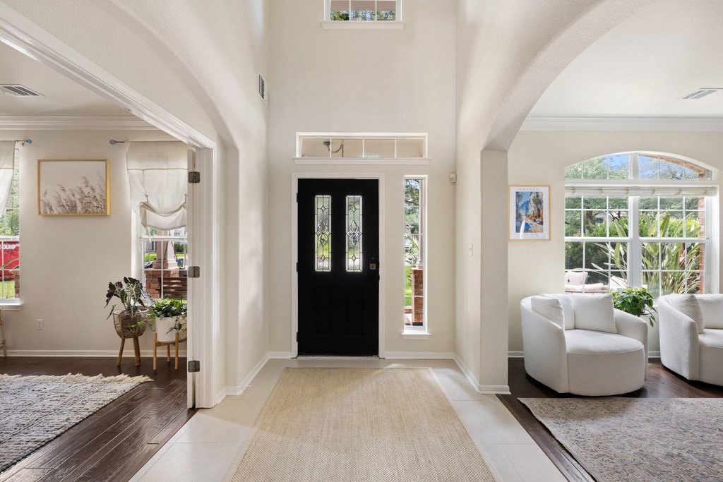 6704 Kiev Cove Austin, TX 78739 - Photo 13 of 37 A grand entry with a towering ceiling creates a welcoming atmosphere.