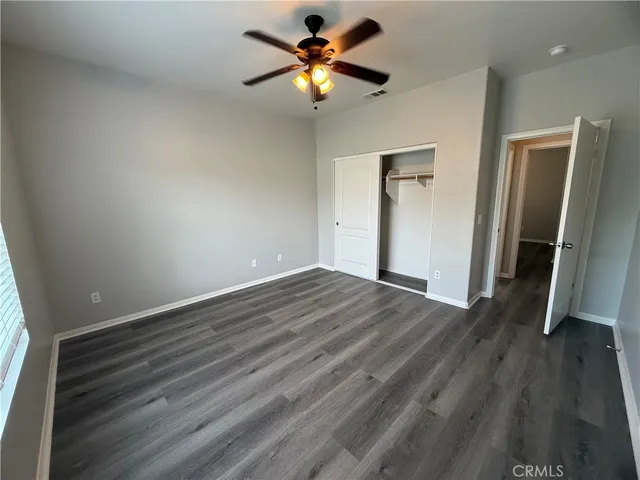 a spacious bathroom with a double vanity sink a large mirror and a bathtub