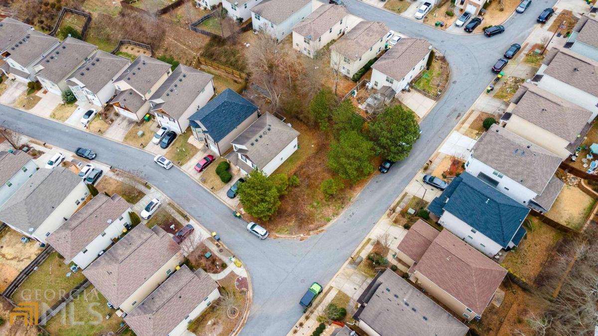 an aerial view of residential house with outdoor space