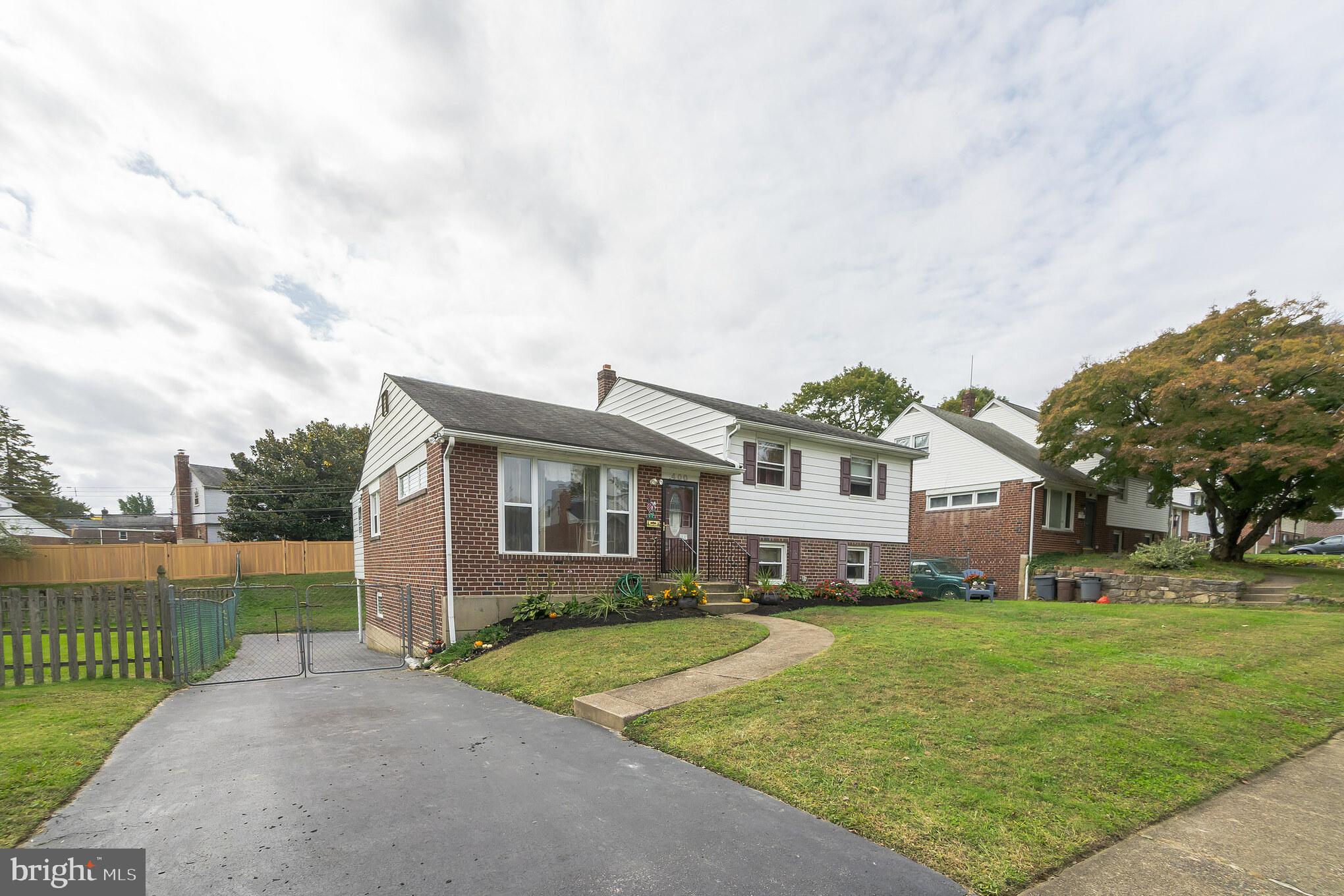 400 Achille Road Havertown, PA 19083 - Photo 1 of 1 a front view of a house with a yard