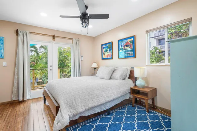 a bedroom with a large bed and a large window