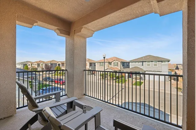 a view of a balcony with furniture