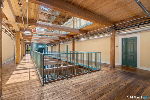 a view of balcony with wooden floor