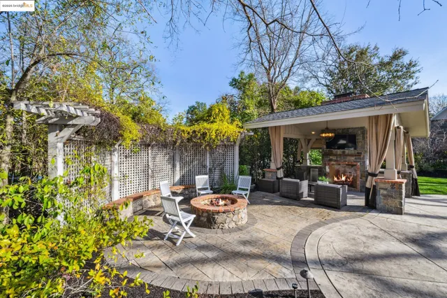 a bedroom with a bed a couch and a potted plant