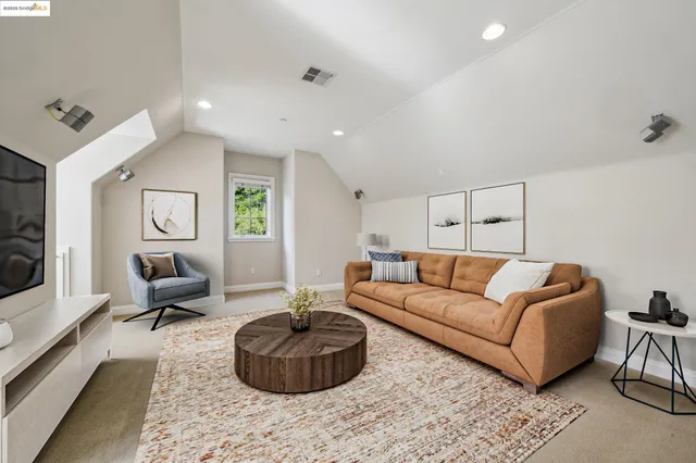 a kitchen with stainless steel appliances granite countertop a sink and a refrigerator