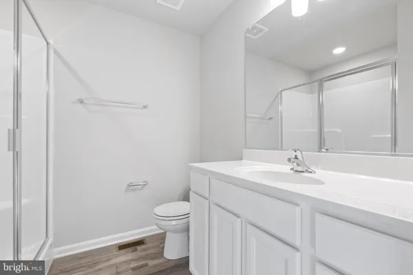 a view of a lake with houses in the back