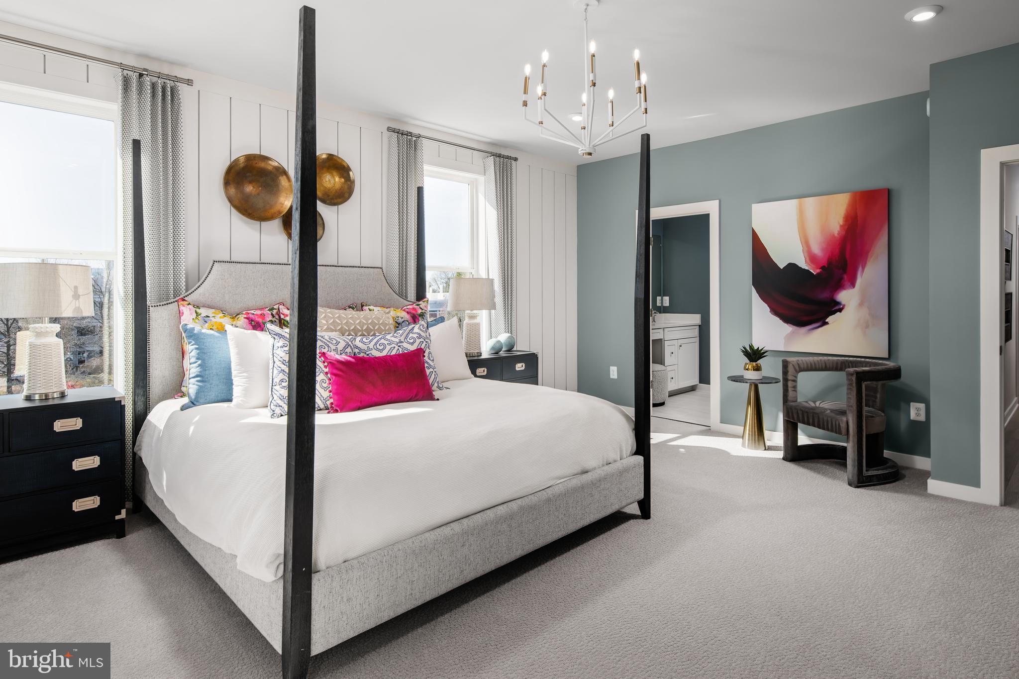 2167 Glacier Road Herndon, VA 20170 - Photo 13 of 32 a bedroom with bed and a chandelier