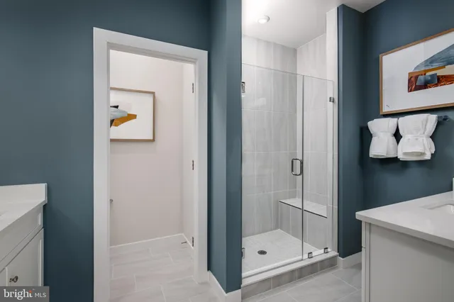 a bathroom with a glass shower door