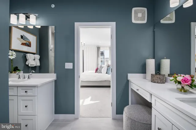 a en suite bathroom with a sink and a mirror