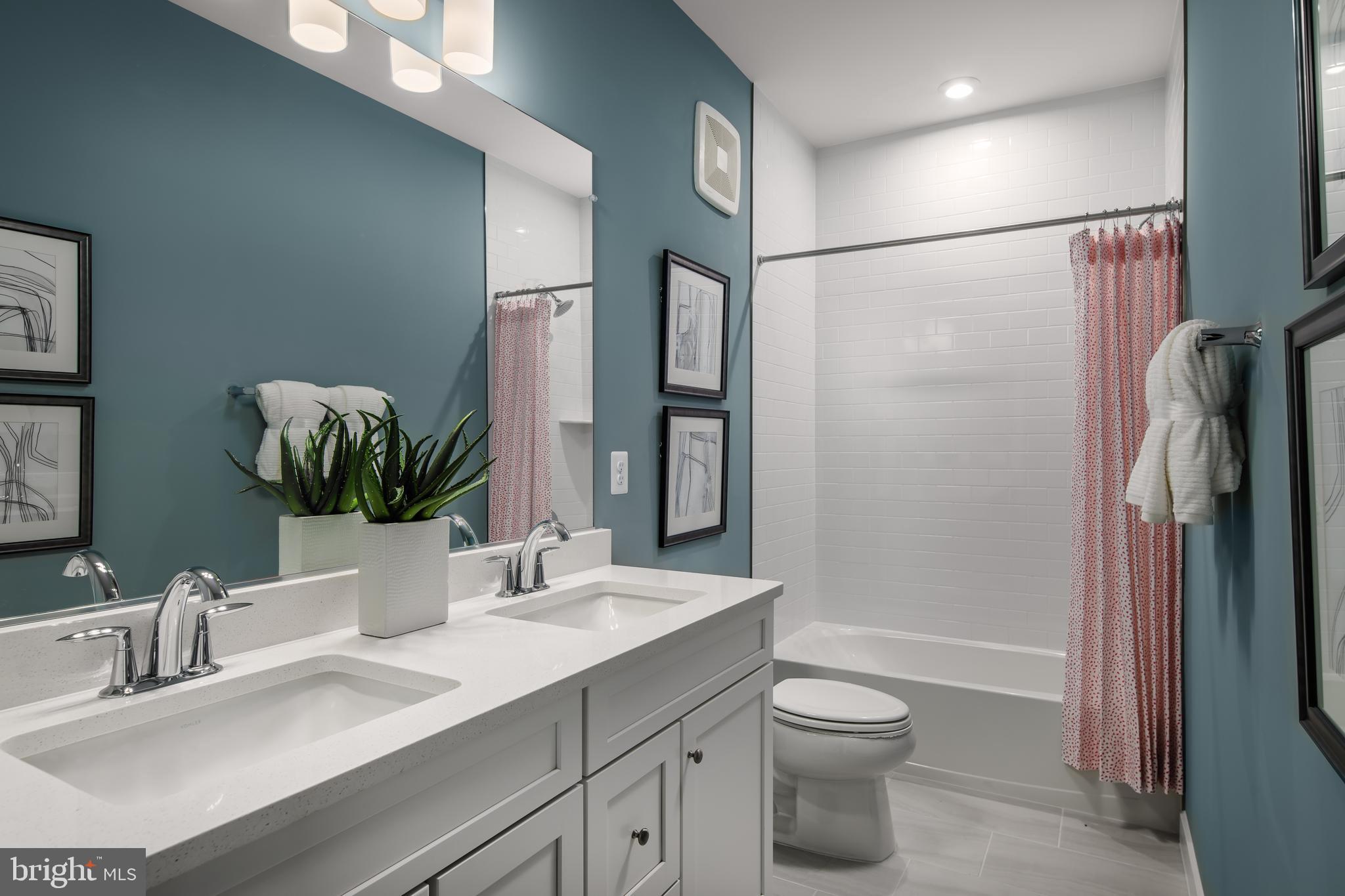 2167 Glacier Road Herndon, VA 20170 - Photo 18 of 32 a bathroom with a sink a toilet and shower