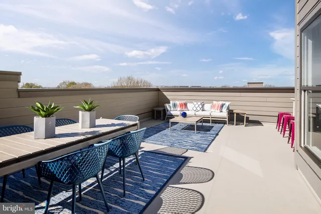 a view of a terrace with furniture and a table
