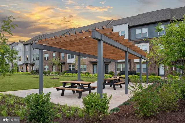 a city view with tall buildings and a yard