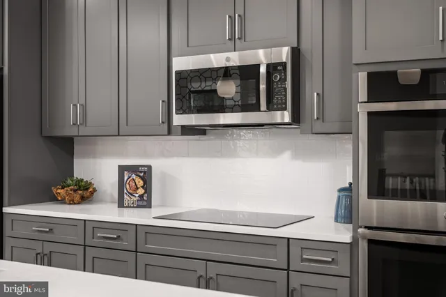 a kitchen with a microwave and cabinets