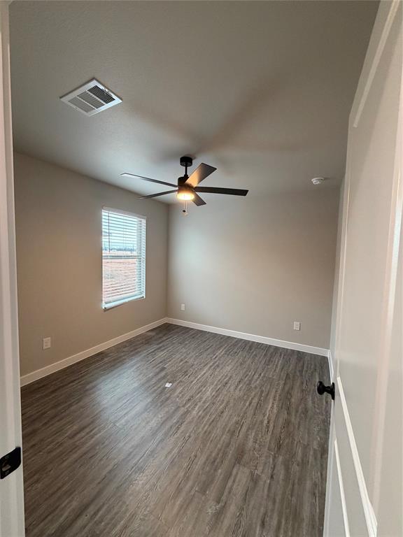 4217 Ranger Street Abilene, TX 79601 - Photo 14 of 20 wooden floor in an empty room with a window