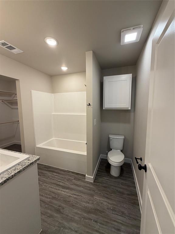 4217 Ranger Street Abilene, TX 79601 - Photo 18 of 20 a bathroom with a toilet a sink and bathtub