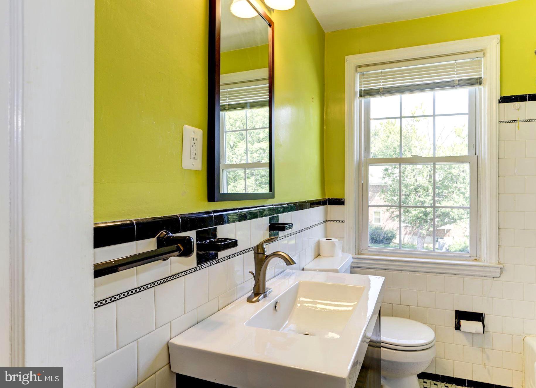 3602 Delverne Road Baltimore, MD 21218 - Photo 22 of 28 a bathroom with a sink and a mirror