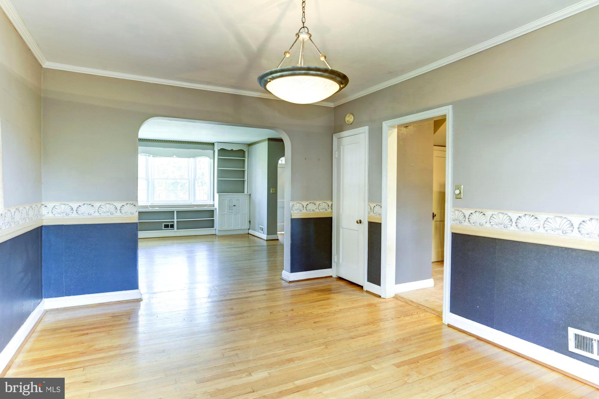 3602 Delverne Road Baltimore, MD 21218 - Photo 9 of 28 a view of a room with wooden floor and staircase