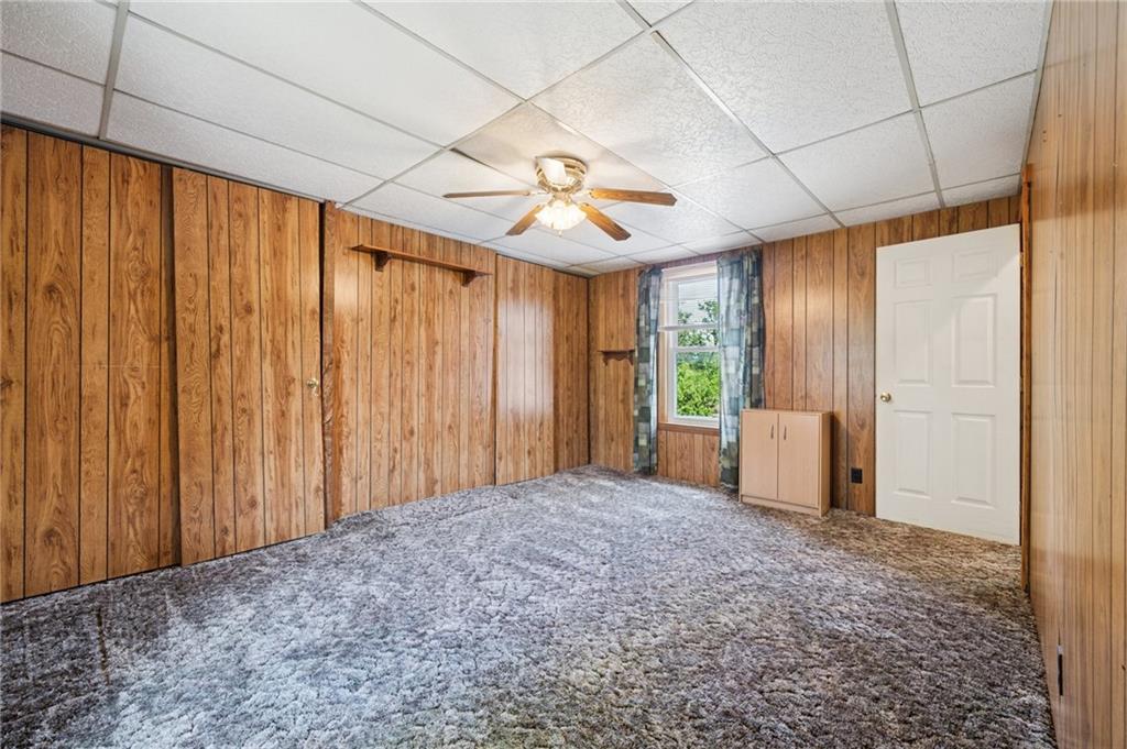600 Scott Street Penn, PA 15675 - Photo 19 of 33 a view of a big room with windows and chandelier fan